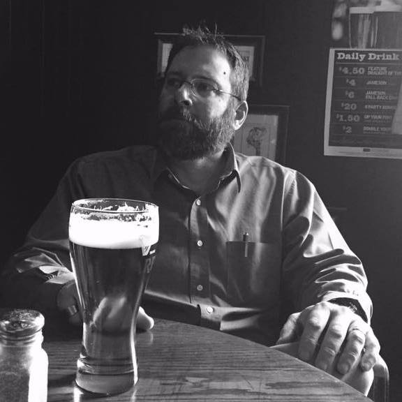 Headshot of Marc
            J Gilbert at bar